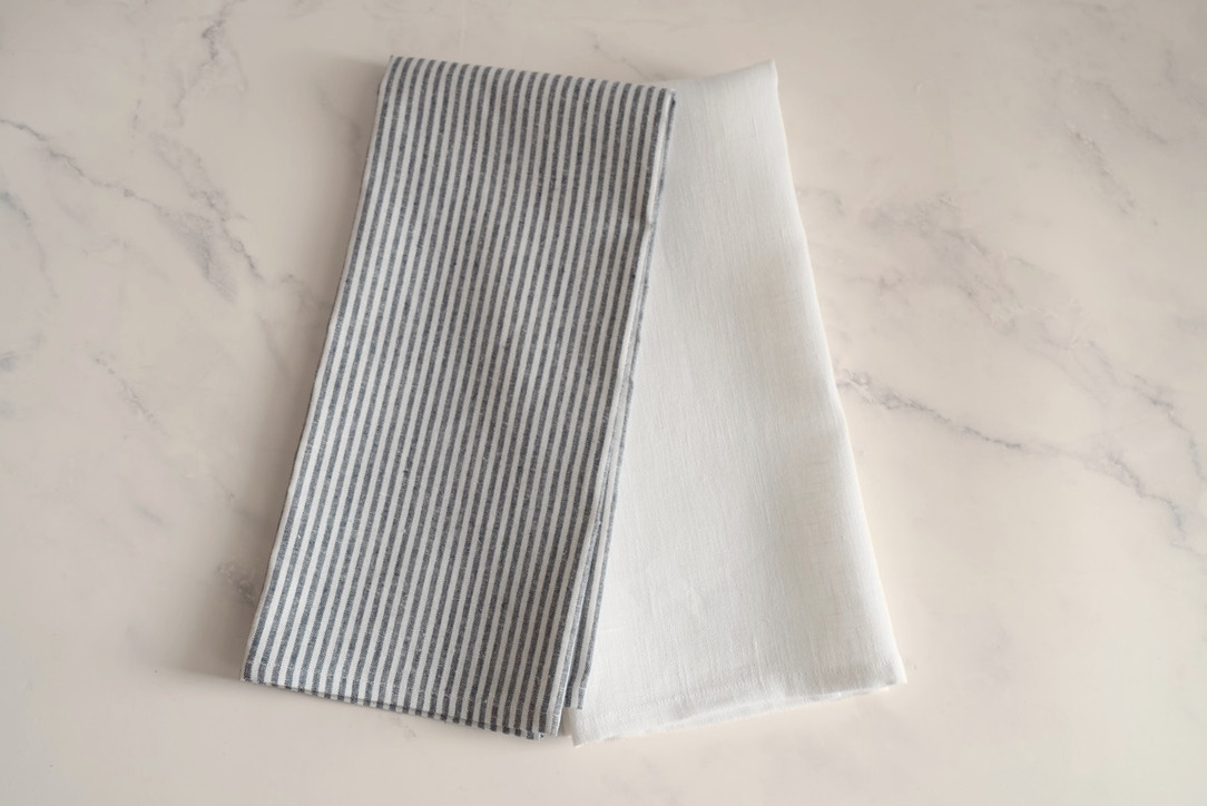 Kitchen gift set with a heart charcuterie board, kitchen towels, and beechwood spoons.