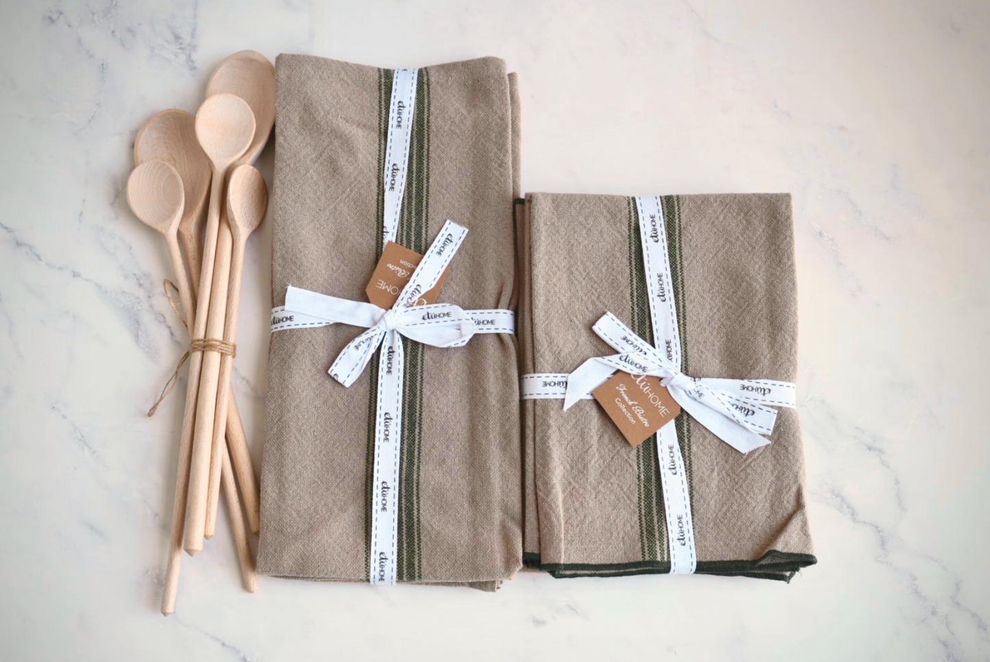 Kitchen gift set with spruce green stripe towels, napkins, and beechwood spoons.