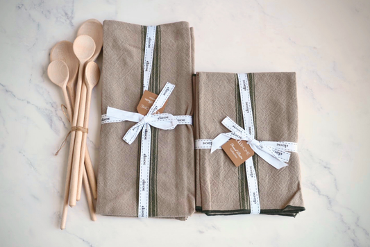 Kitchen gift set with spruce green stripe towels, napkins, and beechwood spoons.
