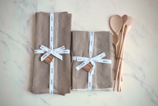 Kitchen gift set with white stripe towels, napkins, and beechwood spoons.